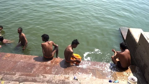 Pilgrims take bath in River Ganges 스톡 동영상 103421933