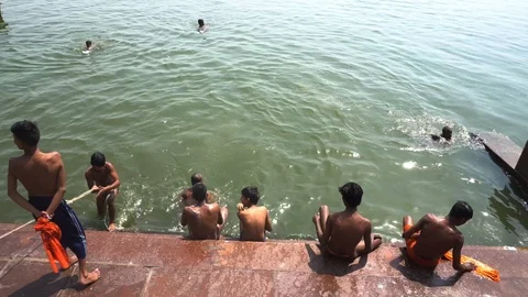 Pilgrims take bath in River Ganges Stock Footage 103421996