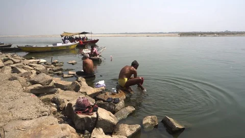 Pilgrims take bath in River Ganges 스톡 동영상 103422130