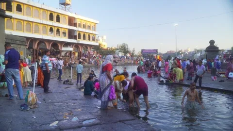 Pilgrims taking holy bath in sacred Godavari River on Mahashivratri Day Stock Footage 314706964