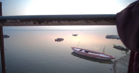 Pilgrims taking a holy dip at sunrise in sacred river Ganges, Varanasi, India Stock Footage 115288308