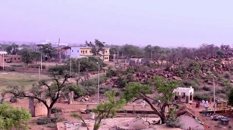 Pilgrims walk around the tip of Govardhan Hill in India. Stock Footage 51109012