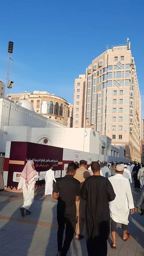 Pilgrims Walking Past Ali Bin Abi Talib Mosque Stock Footage 344059723