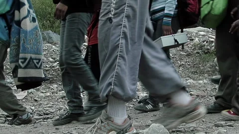 Pilgrims Walking on Rocky Path During Holy Week Pilgrimage, Tilcara, Argentina 스톡 동영상 318758775