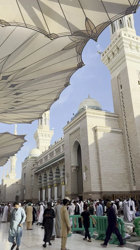 Pilgrims Walking Through the Prophet's Mosque Stock Footage 327927343