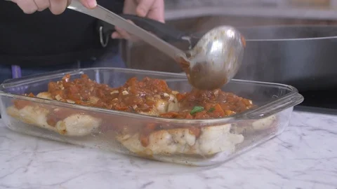 Piling Red Sauce on Chicken Stock Footage 97647320