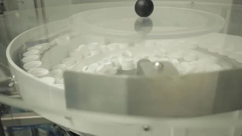 Pill Bottle Capping Machine - Preparing the Caps Stock Footage 71455222