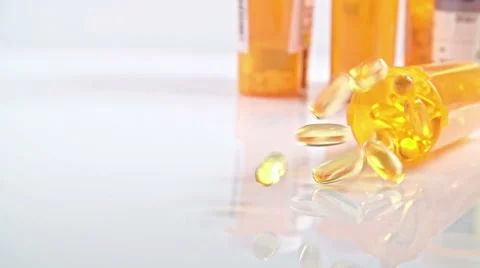 Pill Bottle Falling Down Stock Footage 56909156