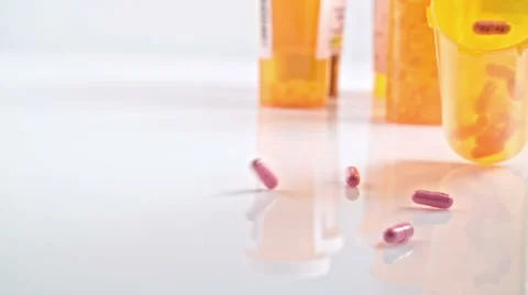 Pill Bottle Falling Down Stock Footage 56909671