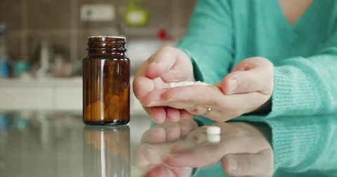 Pill Bottle On The Glass Table Stock Footage 237595403