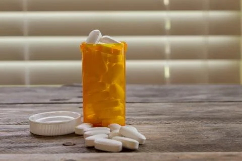 PIll bottle on kitchen table Stock Photos
