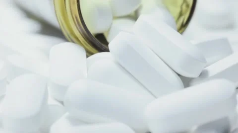 Pill Bottle Overflowing With White Tablets Vídeos de archivo 68804521