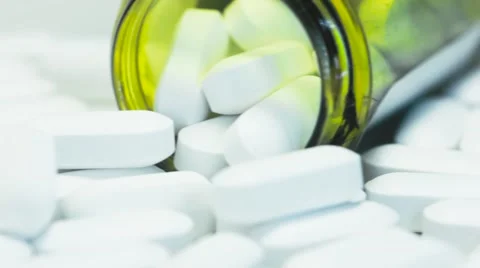 Pill Bottle Overflowing With White Tablets 库存影片 68804587