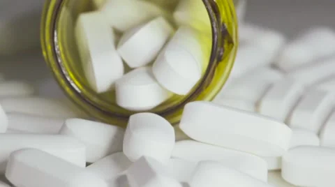 Pill Bottle Overlowing With Pill Tablets Vidéo 68805138