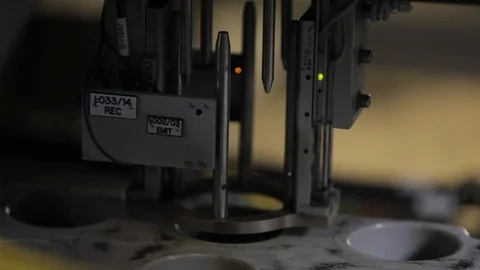 Pill bottles. Robotic mechanical assembly. Placing in trays. cu Stock Footage 102186414