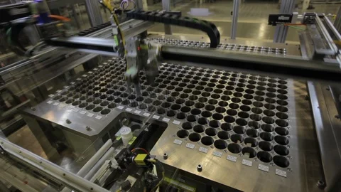 Pill bottles. Sorted automatically into numbered slots B Stock Footage 102186526