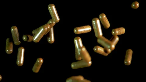 Pill capsules falling on the mirror table. Slowmotion shot, 180 fps Stock Footage 86283623