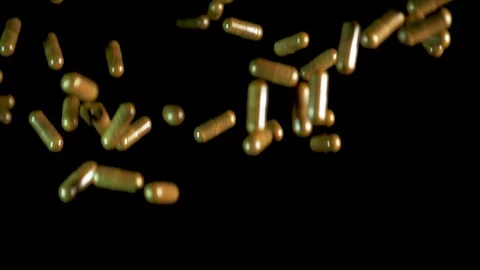 Pill capsules falling on the mirror table. Slowmotion shot, 180 fps Stock Footage 86283638
