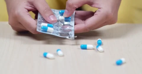 Pill dispensing process home tutorial indoor setting close-up view health Stock Footage 334258451