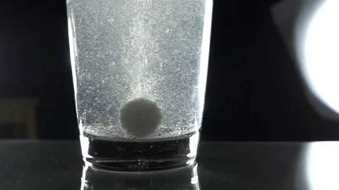 The pill dissolves in water Stock Footage 92012666