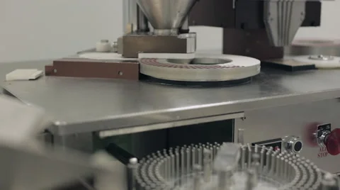 Pill Encapsulation Machine Filling Capsules with Powder Stock Footage 68642734