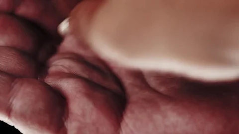 Pill falling in an open palm. Multiple takes. Stock Footage 82877515