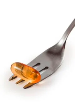 Pill on the fork Stock Photos
