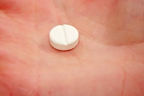 Pill in hand Stock Photos
