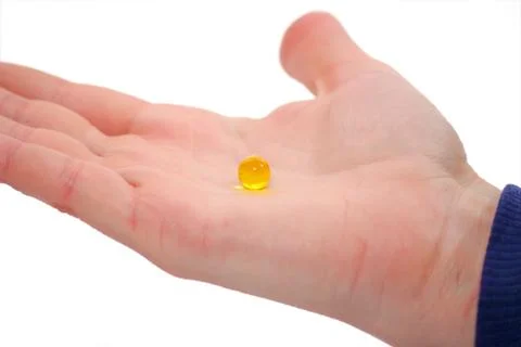 Pill in hand Stock Photos