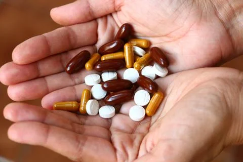 Pill on hand Stock Photos