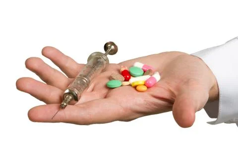 Pill in a hand 스톡 사진