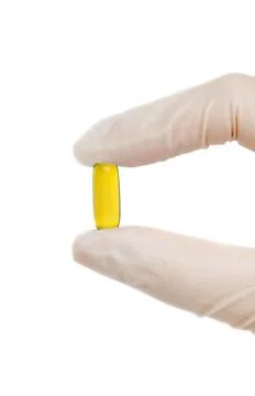 Pill in hand Stock Photos