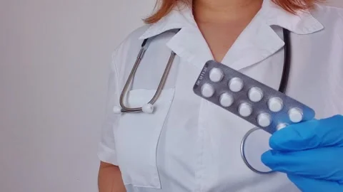 Pill in the hands of a doctor Stock Footage 307539889