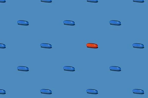 Pill or vitamin capsule pattern on blue background Stock Photos