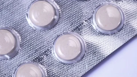 Pill packaging close-up rotate slow mo Stock Footage 168508985