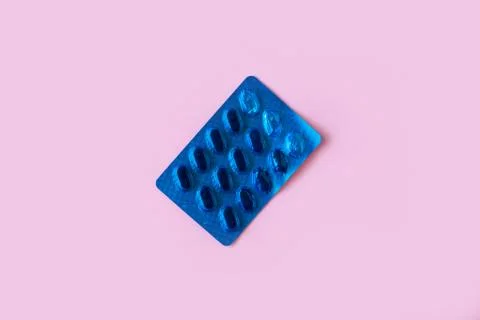 Pill packaging on pink background. Stock Photos