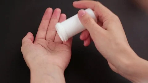 The pill pours out of the vial Stock Footage 82272276