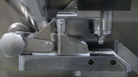 Pill press machine at the pharmaceutical factory Stock Footage 70316609