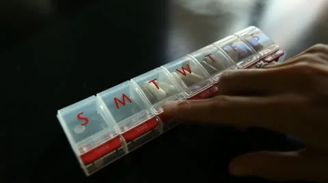 PILL REMINDER POUR Stock Footage