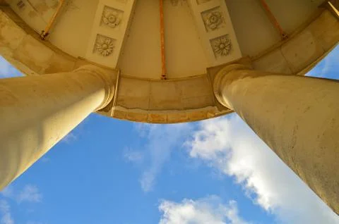 Pillar and ceiling of an ancient building with blue sky background Stock Photos