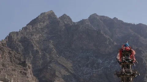 Pillar with flags in front of Mountains Stock Footage 75212174