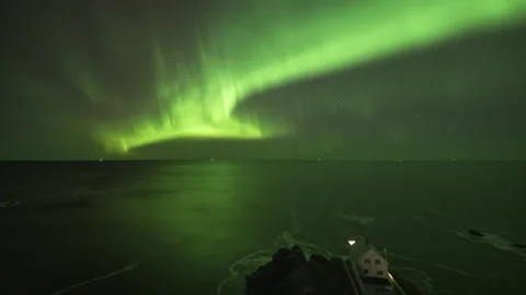 Pillars of Aurora Borealis over lighthouse Stock Footage 266918656