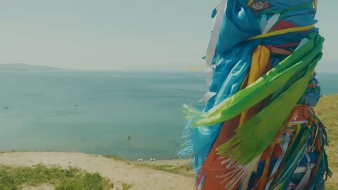 Pillars with colored ribbons are a religious symbol in the sacred place of Video stock 128419035