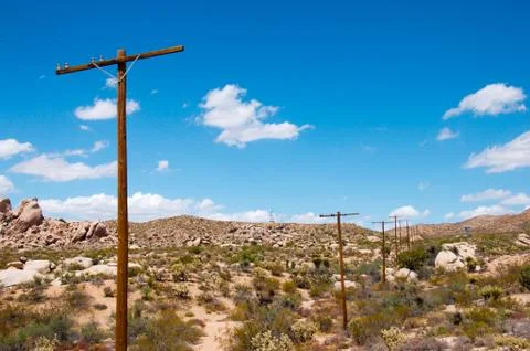 Pillars wire in a desert Stock Photos