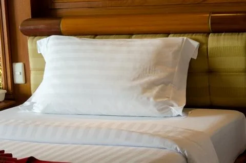 Pillow on bed Stock Photos