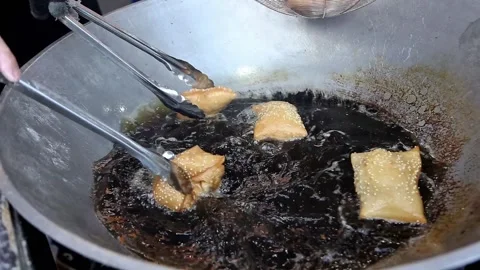 Pillow Cake or Odading is being fried in a frying pan Stock Footage 267681467