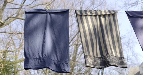 Pillow Covers drying / Hanging from clothesline on a sunny day. 4K Stock-Footage 151122584