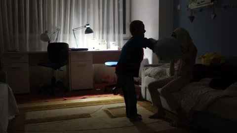 Pillow fight before bedtime Stock Footage 297676322