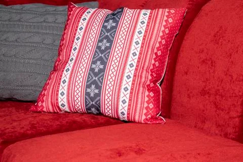 Pillow on a red sofa. Stock Photos