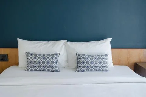 Pillows on bed Stock Photos